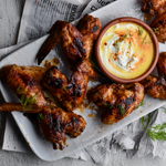 Recipe : Baked spicy sticky wings served with feta dip